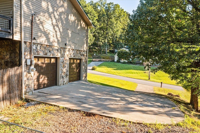 exterior space featuring a yard and a garage