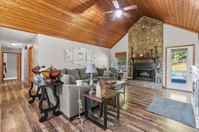 living room with a stone fireplace, wood-type flooring, wood ceiling, high vaulted ceiling, and ceiling fan