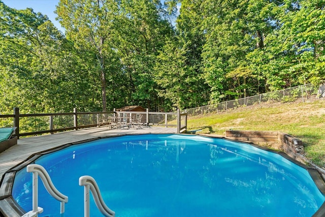 view of pool featuring a wooden deck