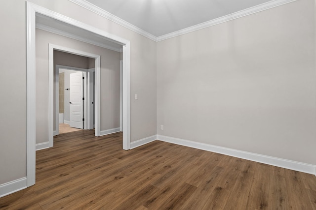 spare room with dark hardwood / wood-style floors and ornamental molding