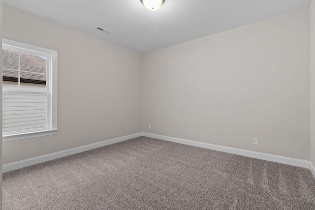 spare room featuring carpet flooring