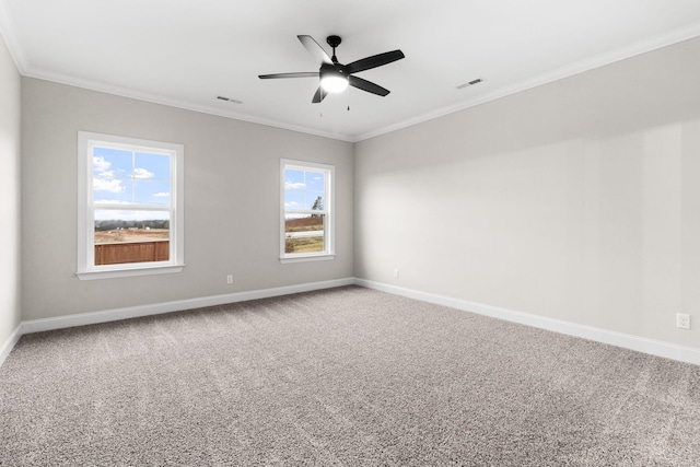 unfurnished room featuring ceiling fan, carpet, and ornamental molding