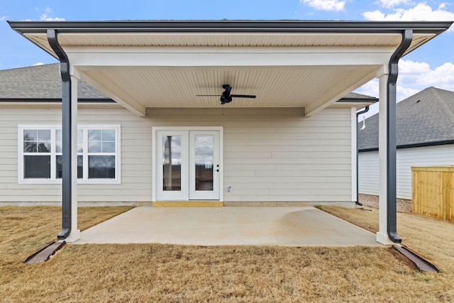 doorway to property featuring ceiling fan, a patio area, and a yard