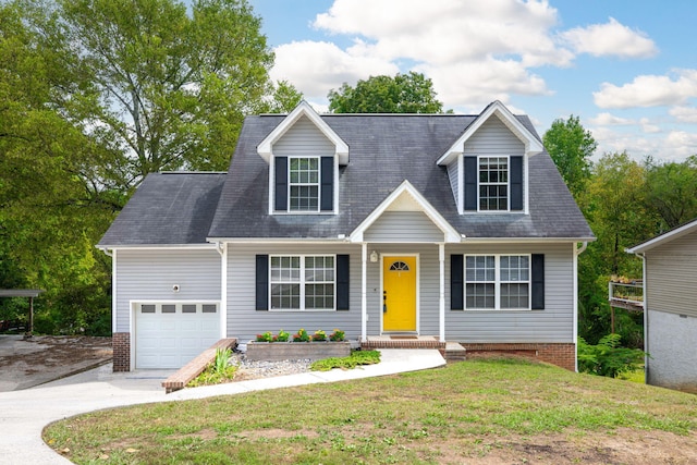 new england style home with a front lawn and a garage