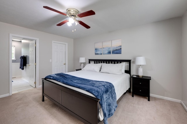 carpeted bedroom with ceiling fan and ensuite bathroom