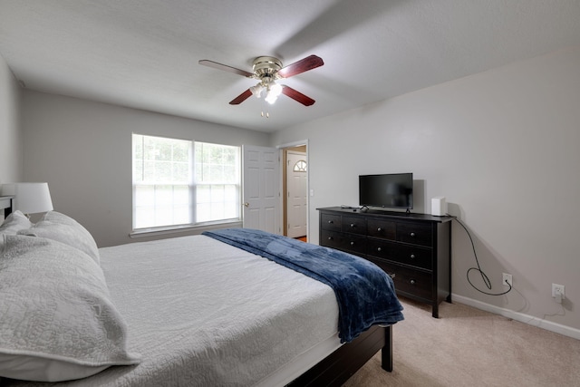 bedroom with light colored carpet and ceiling fan