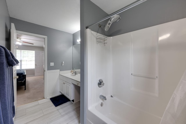 bathroom featuring shower / bath combo, ceiling fan, and vanity