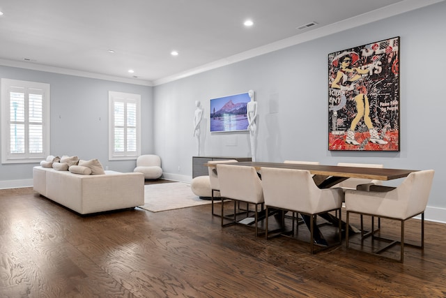 dining space with dark hardwood / wood-style flooring and ornamental molding