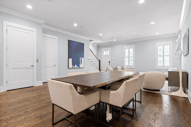 dining room featuring ornamental molding and dark wood-type flooring