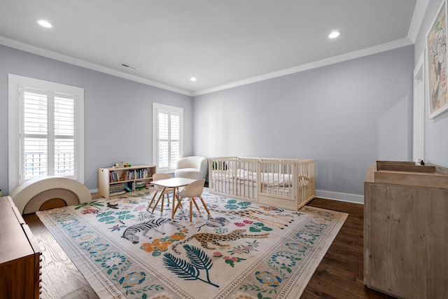 bedroom featuring multiple windows, dark hardwood / wood-style floors, and ornamental molding