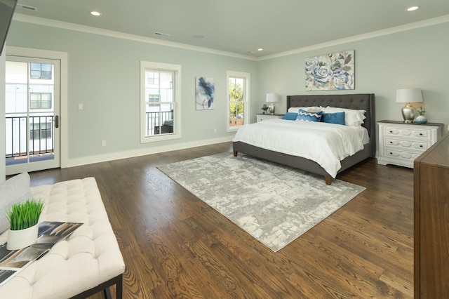 bedroom with dark hardwood / wood-style floors, crown molding, and access to outside