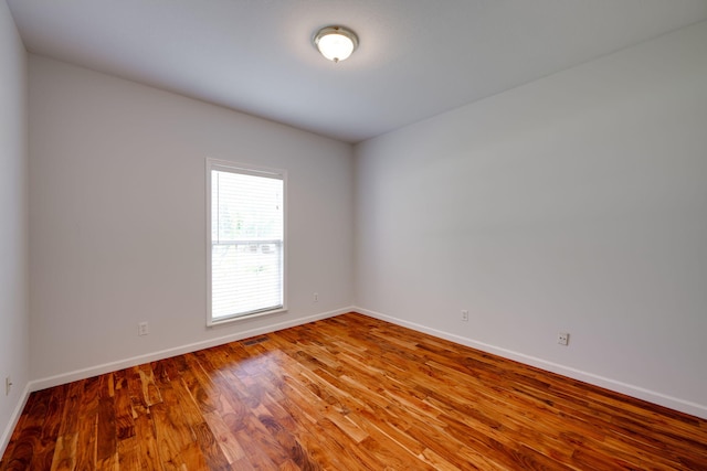 empty room featuring hardwood / wood-style floors