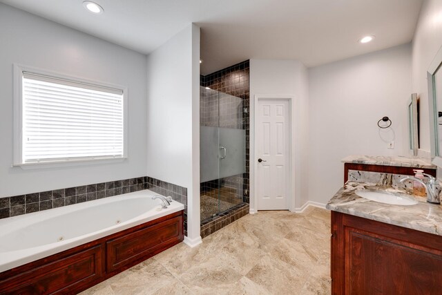 bathroom with vanity, tile patterned floors, and shower with separate bathtub