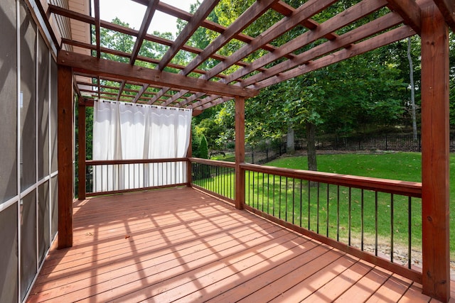 deck featuring a pergola and a yard