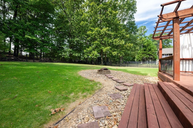 view of yard featuring a pergola and a wooden deck