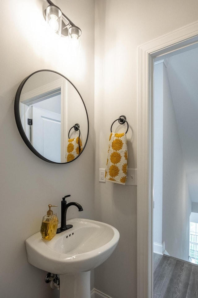 bathroom featuring sink and hardwood / wood-style flooring