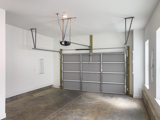 garage with electric panel and a garage door opener