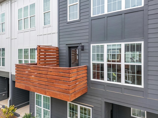 view of side of property with a balcony