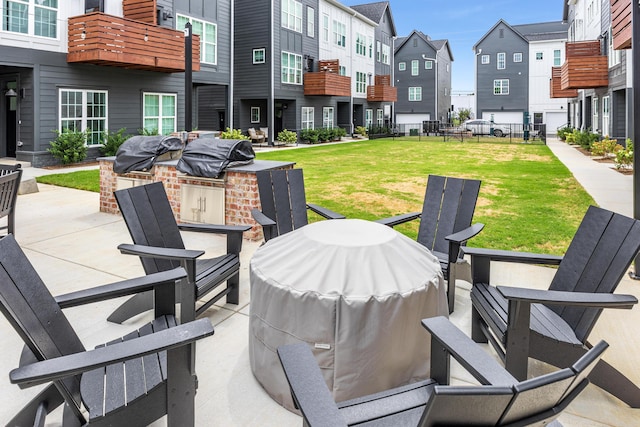 view of patio featuring area for grilling and a balcony