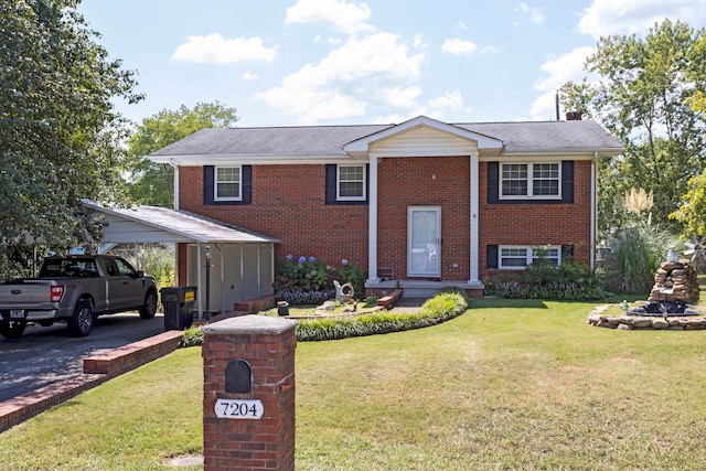 raised ranch with a front yard