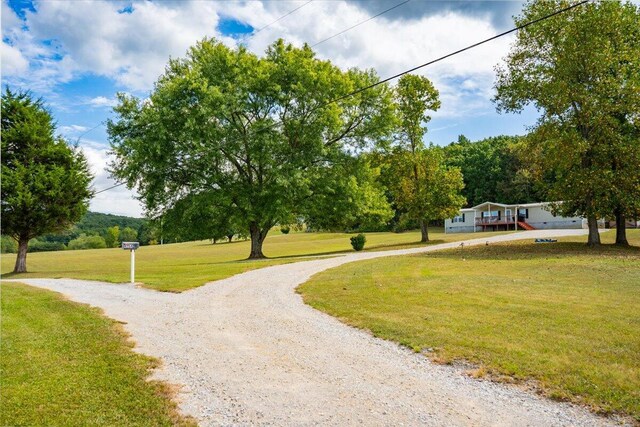 view of property's community featuring a lawn