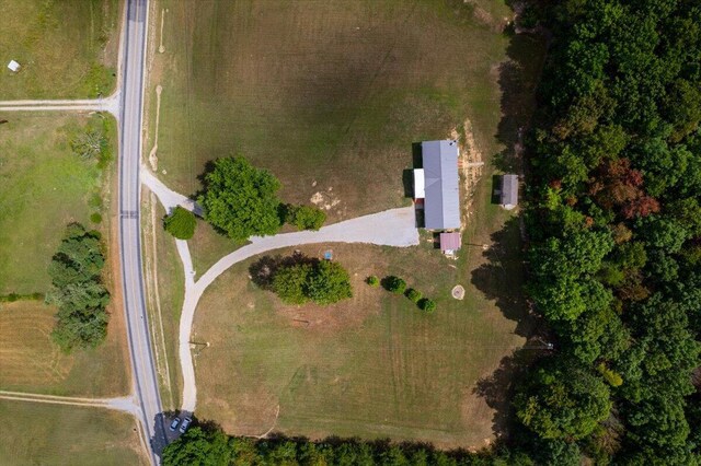 birds eye view of property with a rural view