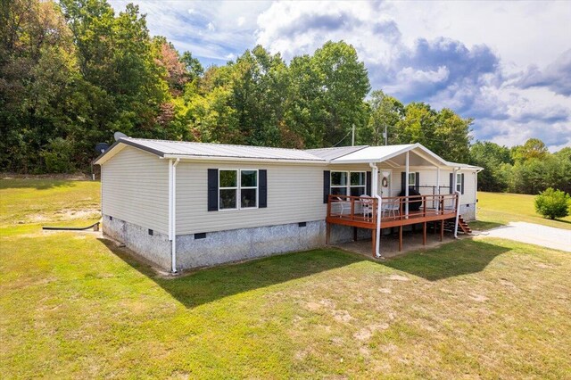 exterior space with a yard and a wooden deck