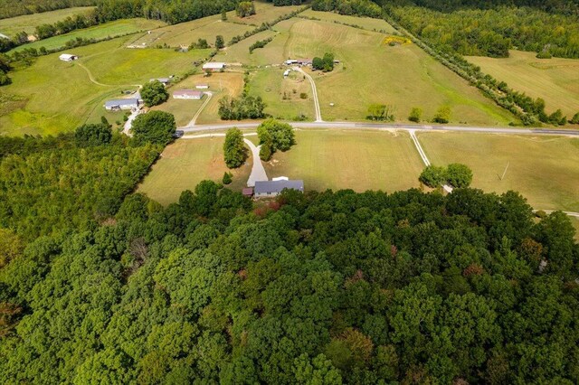 birds eye view of property with a rural view