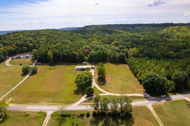 birds eye view of property with a rural view