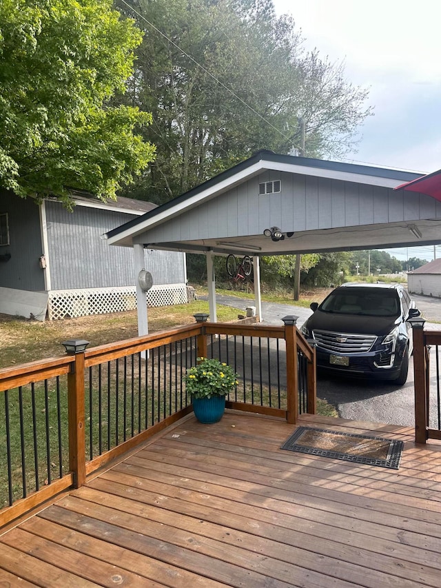 wooden deck with a carport