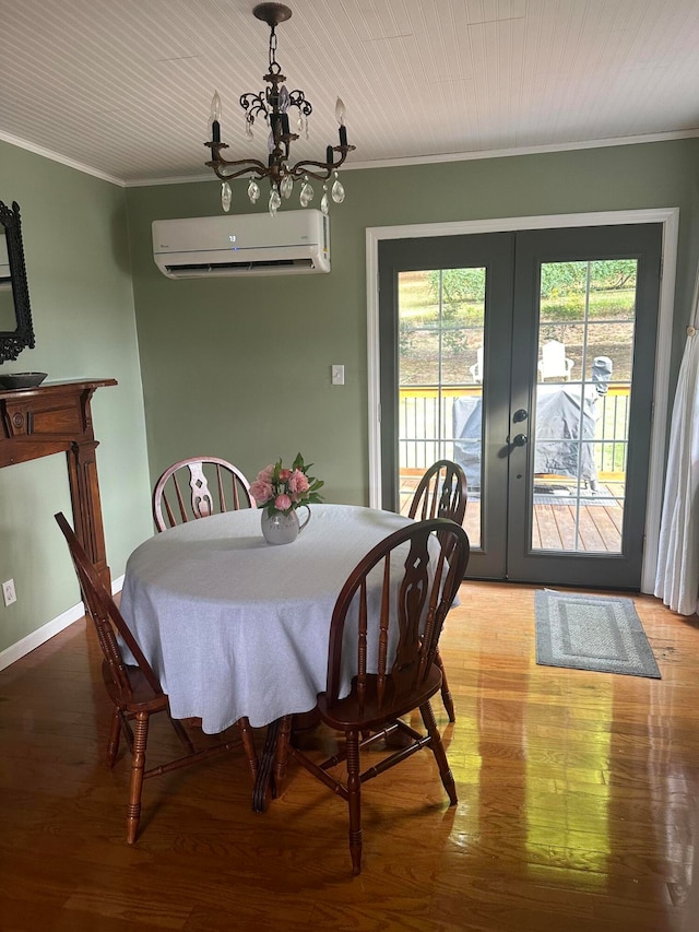 dining room featuring crown molding, hardwood / wood-style flooring, and a wall mounted air conditioner