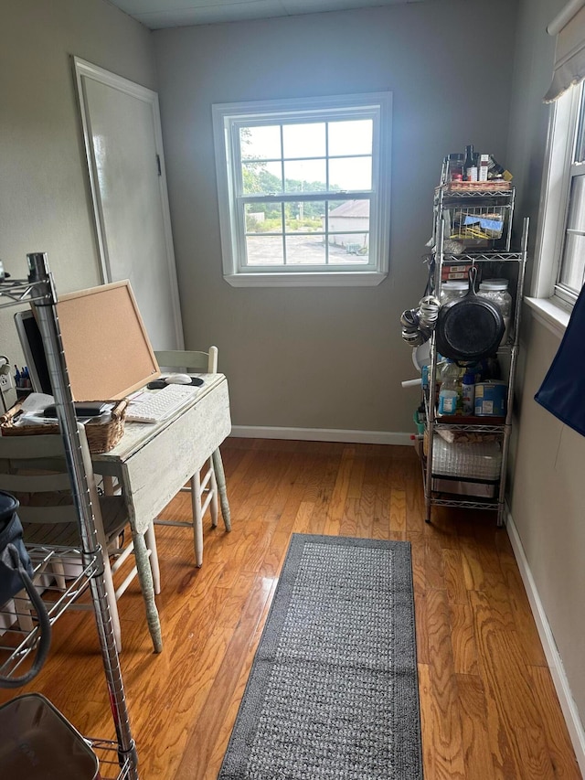 office area with hardwood / wood-style floors