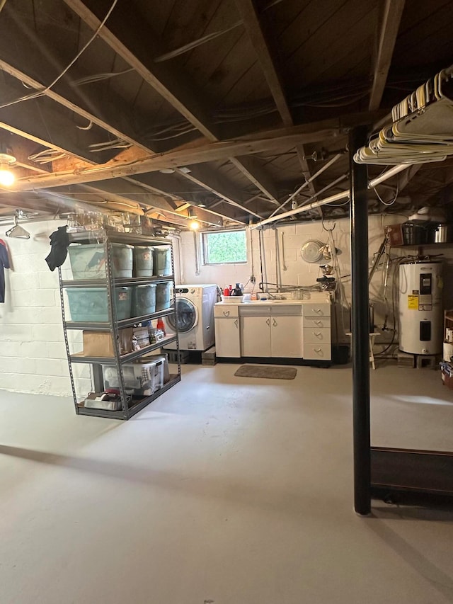 basement with independent washer and dryer and electric water heater