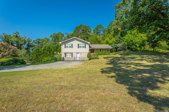 exterior space with a garage and a front lawn