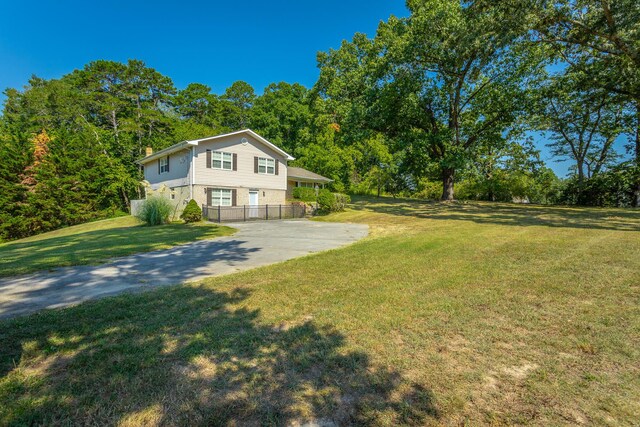 view of side of home featuring a lawn