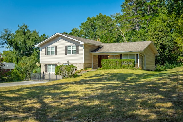 tri-level home with a front yard