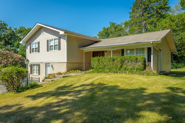 split level home featuring a front lawn