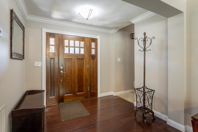 foyer entrance featuring dark hardwood / wood-style flooring and ornamental molding