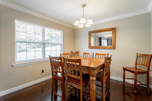 dining room featuring ornamental molding, dark wood-type flooring, and an inviting chandelier