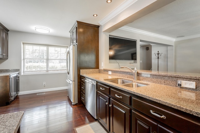 kitchen featuring sink, light stone countertops, dark wood-type flooring, appliances with stainless steel finishes, and dark brown cabinetry