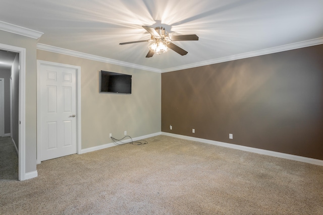 unfurnished room with ceiling fan, light colored carpet, and crown molding