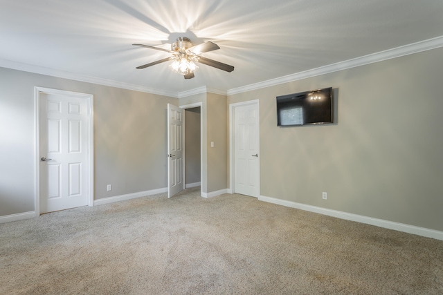 unfurnished bedroom with ceiling fan, crown molding, and light carpet