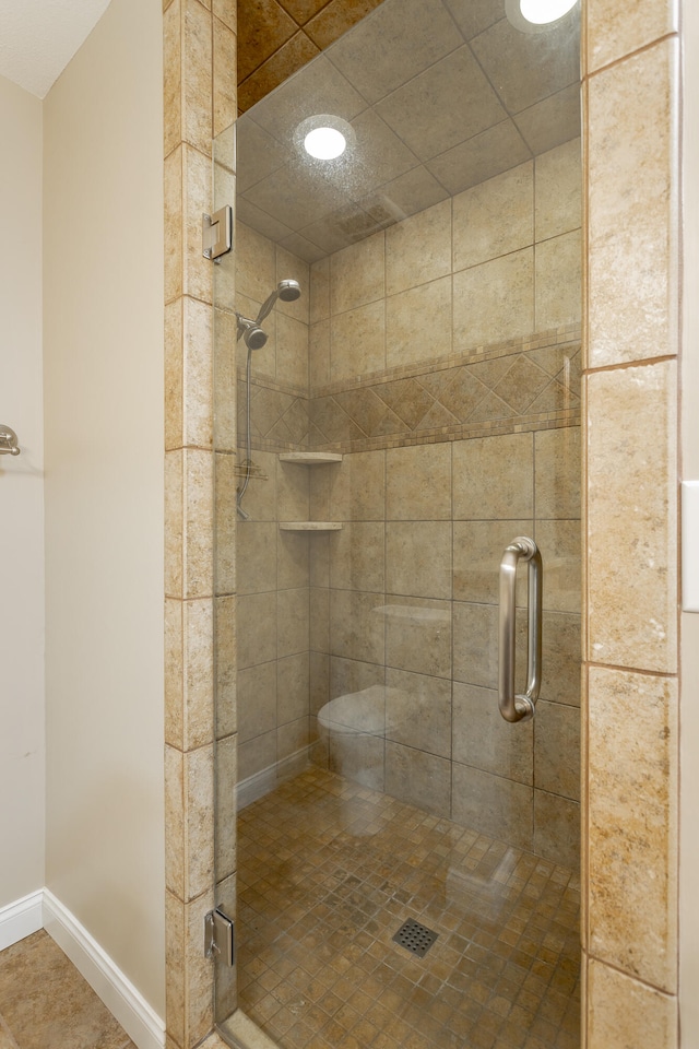 bathroom featuring an enclosed shower