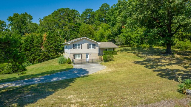 view of front of house featuring a front yard and a garage