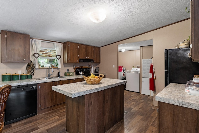 kitchen featuring black appliances, a center island, dark hardwood / wood-style floors, and sink