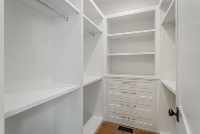 walk in closet featuring hardwood / wood-style flooring