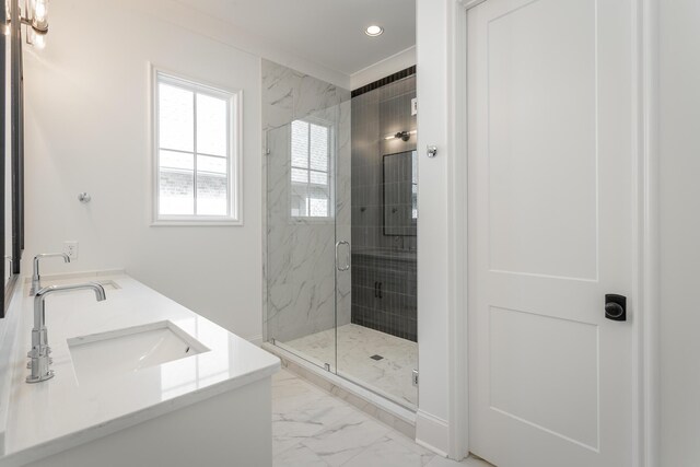 bathroom featuring vanity and a shower with shower door