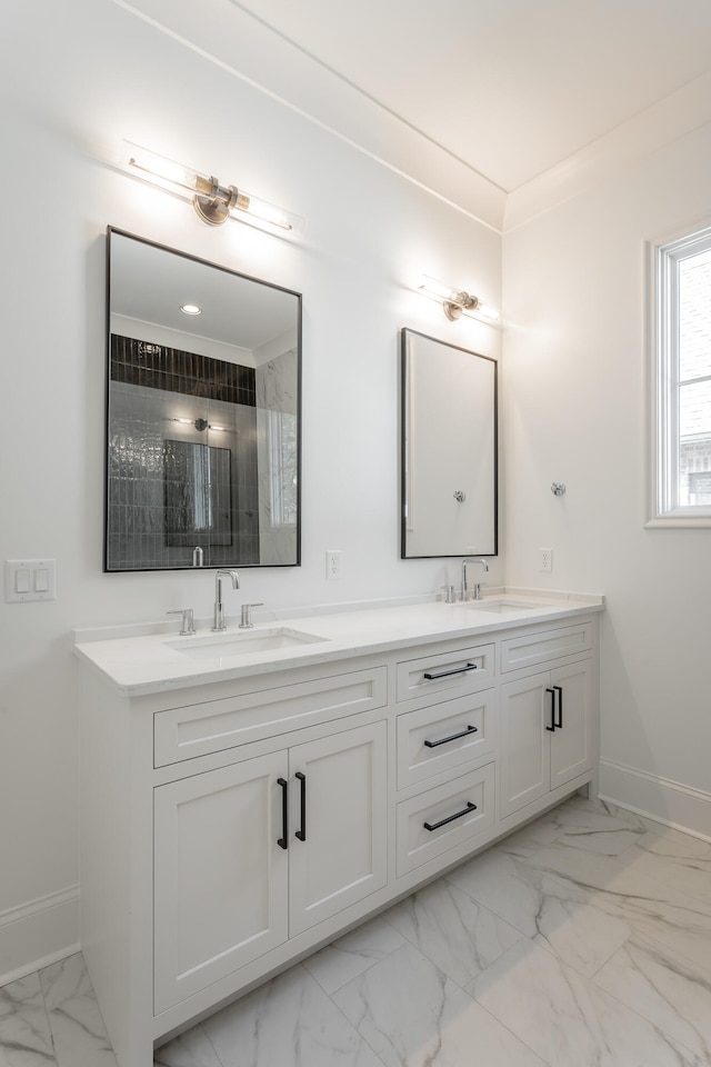 bathroom featuring walk in shower, crown molding, and vanity