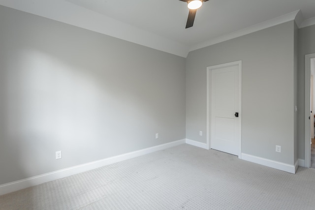 unfurnished room featuring ceiling fan, ornamental molding, and carpet flooring