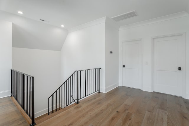 bonus room with wood-type flooring and lofted ceiling